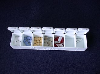 Pill organizer with compartments